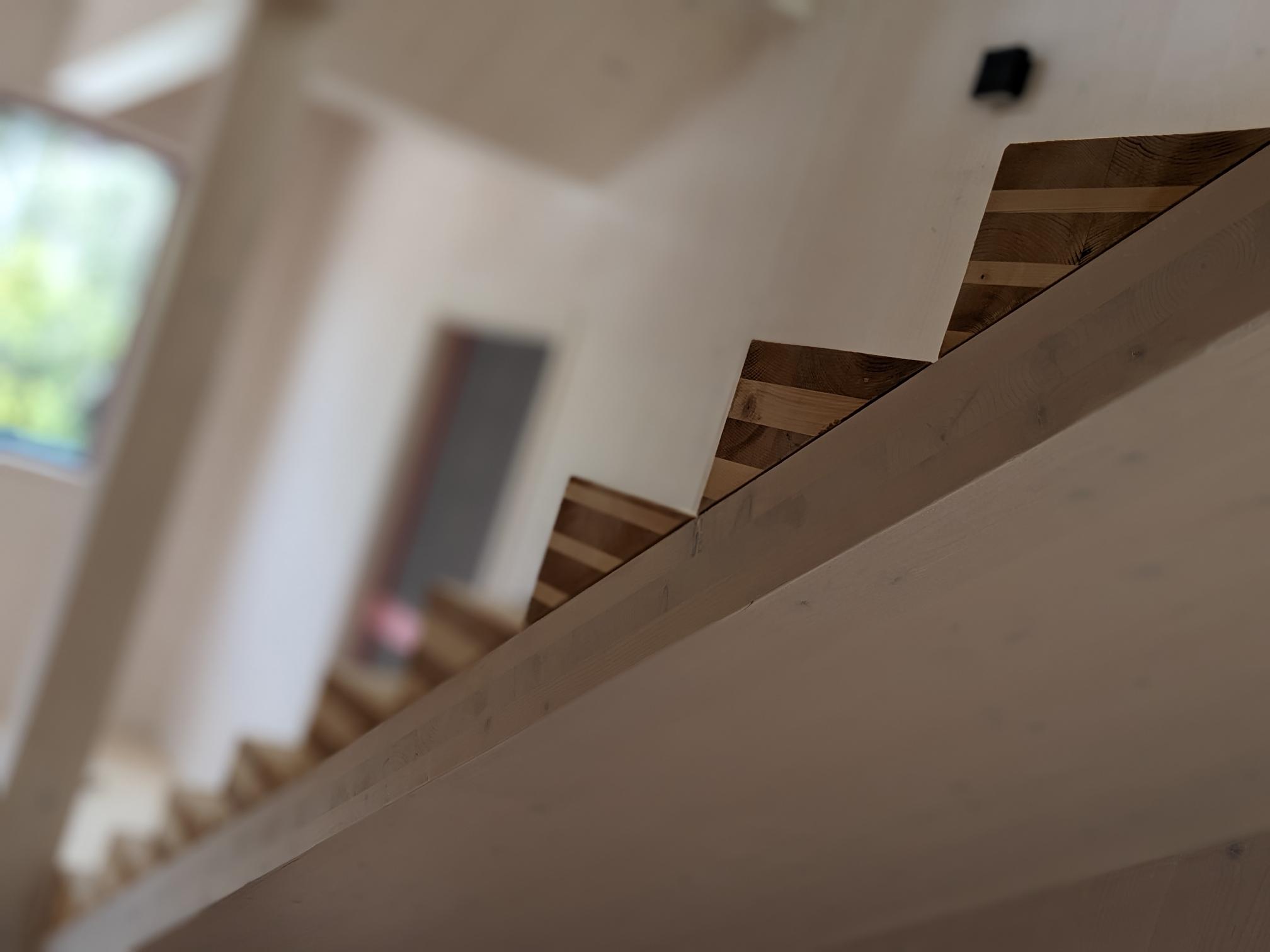 Pre-fabricated timber stairs and visual-grade whitewashed CLT panels