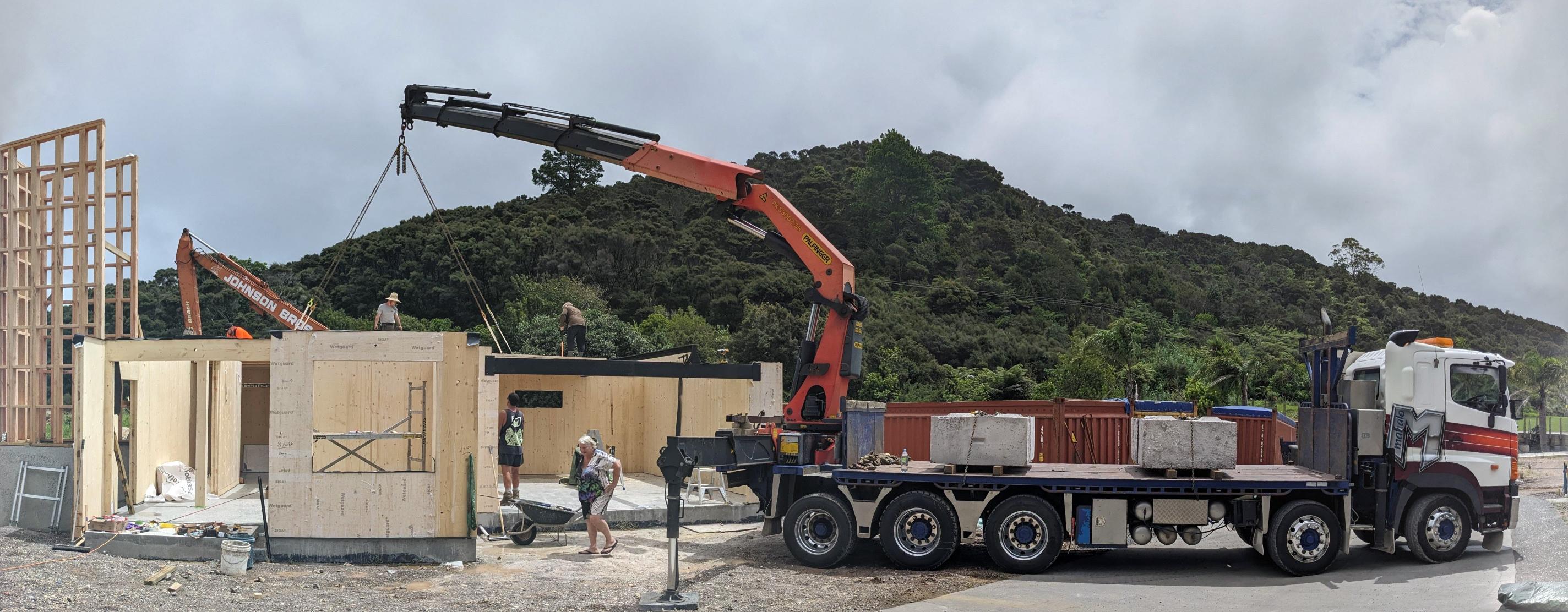 CLT panels being lifted by hiab onto building site