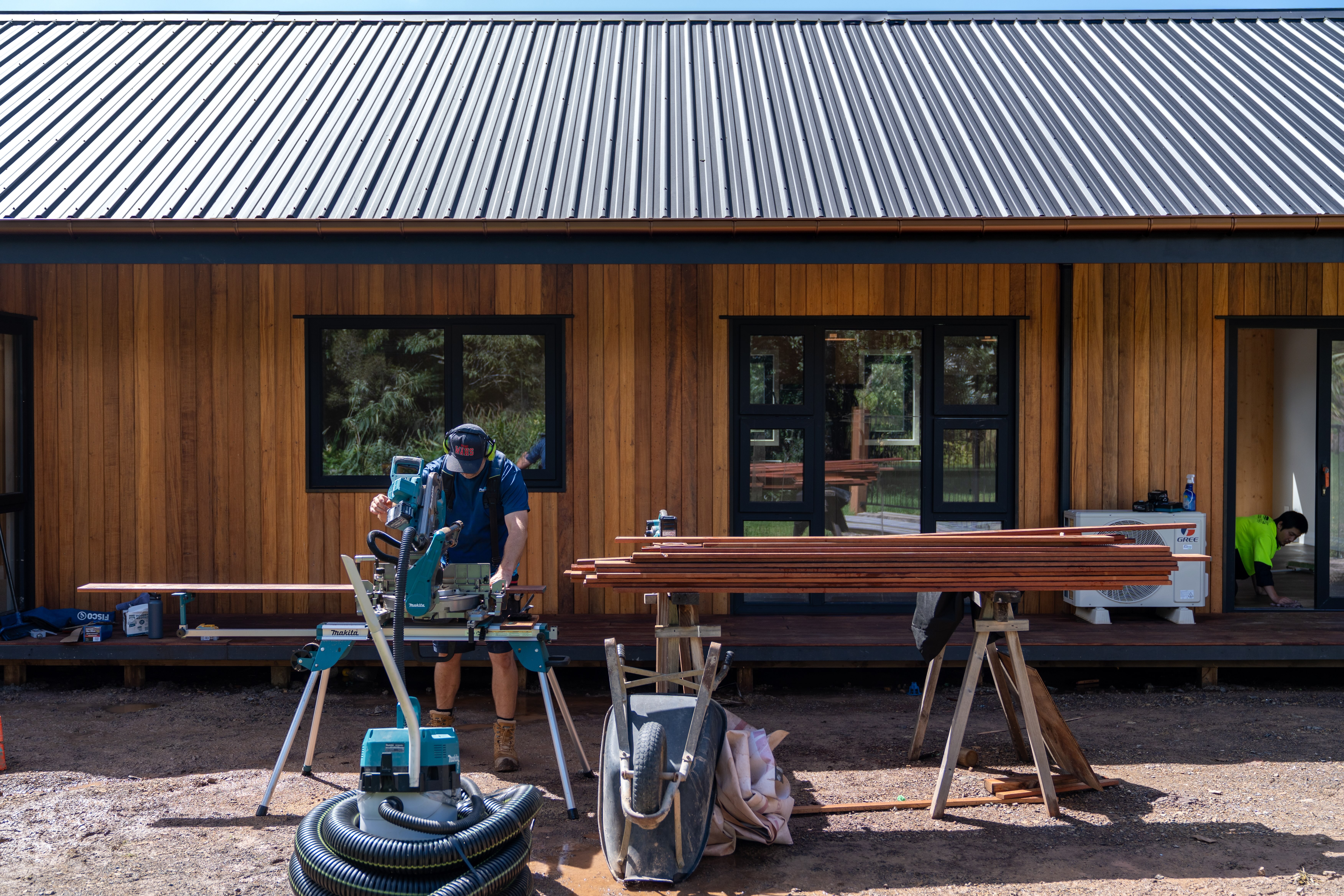 Dargaville Farmhouse — long single-storey kitset timber home on green Northland farmland