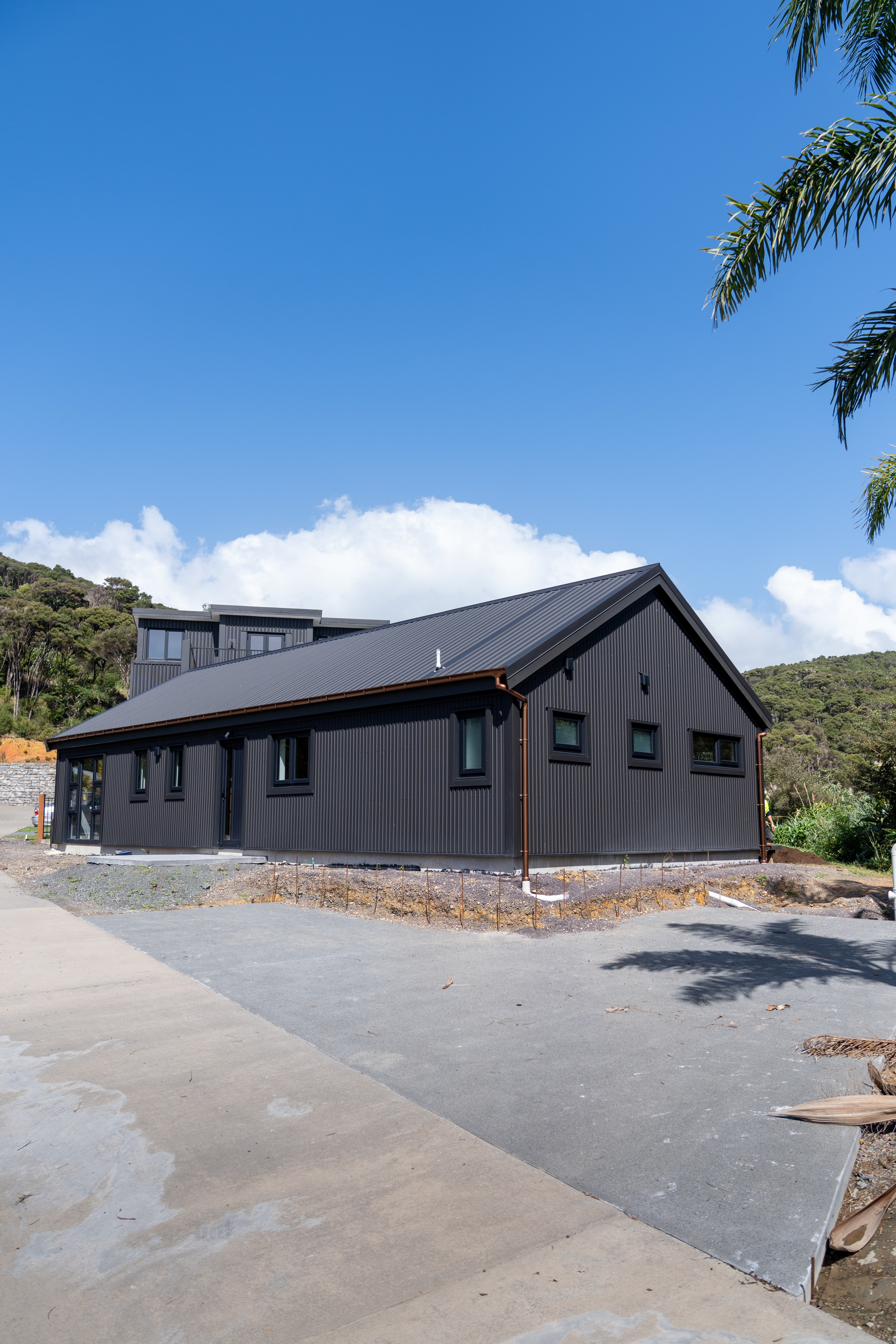 Paihia House — coastal solid timber home with covered deck overlooking the Bay of Islands