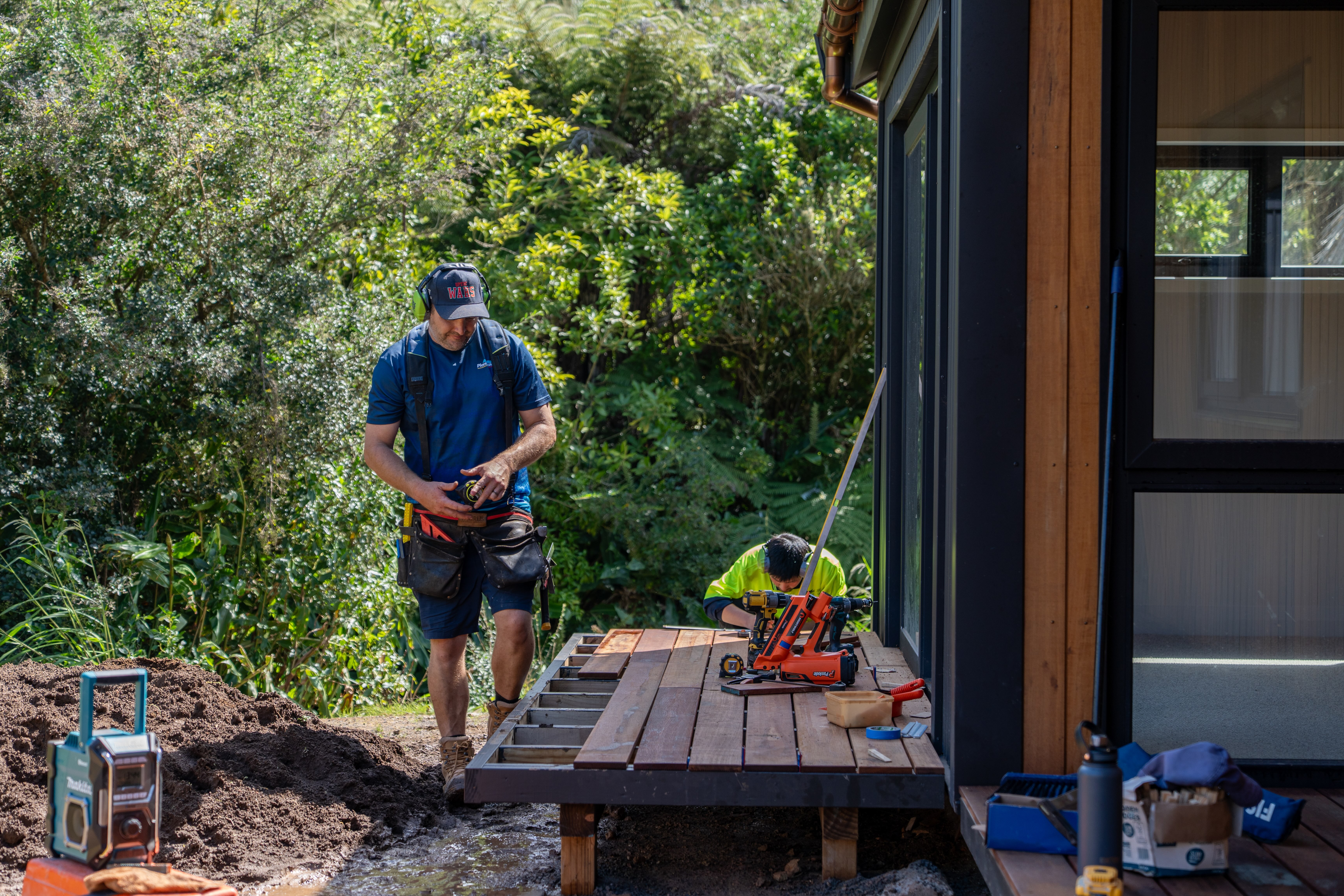 Real Wood Homes builders on site fitting a hardwood deck