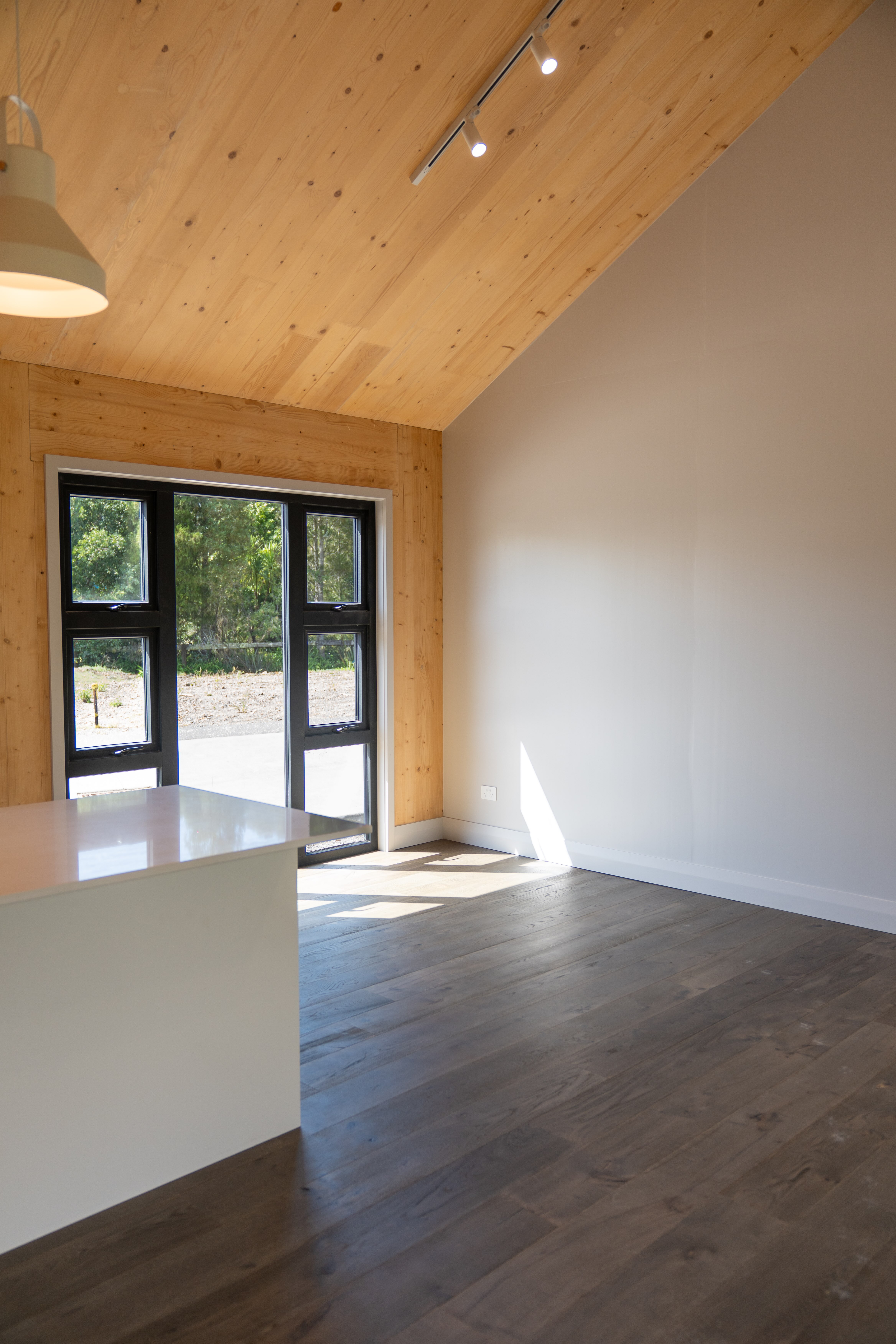 Full timber interior with exposed solid-wood ceiling